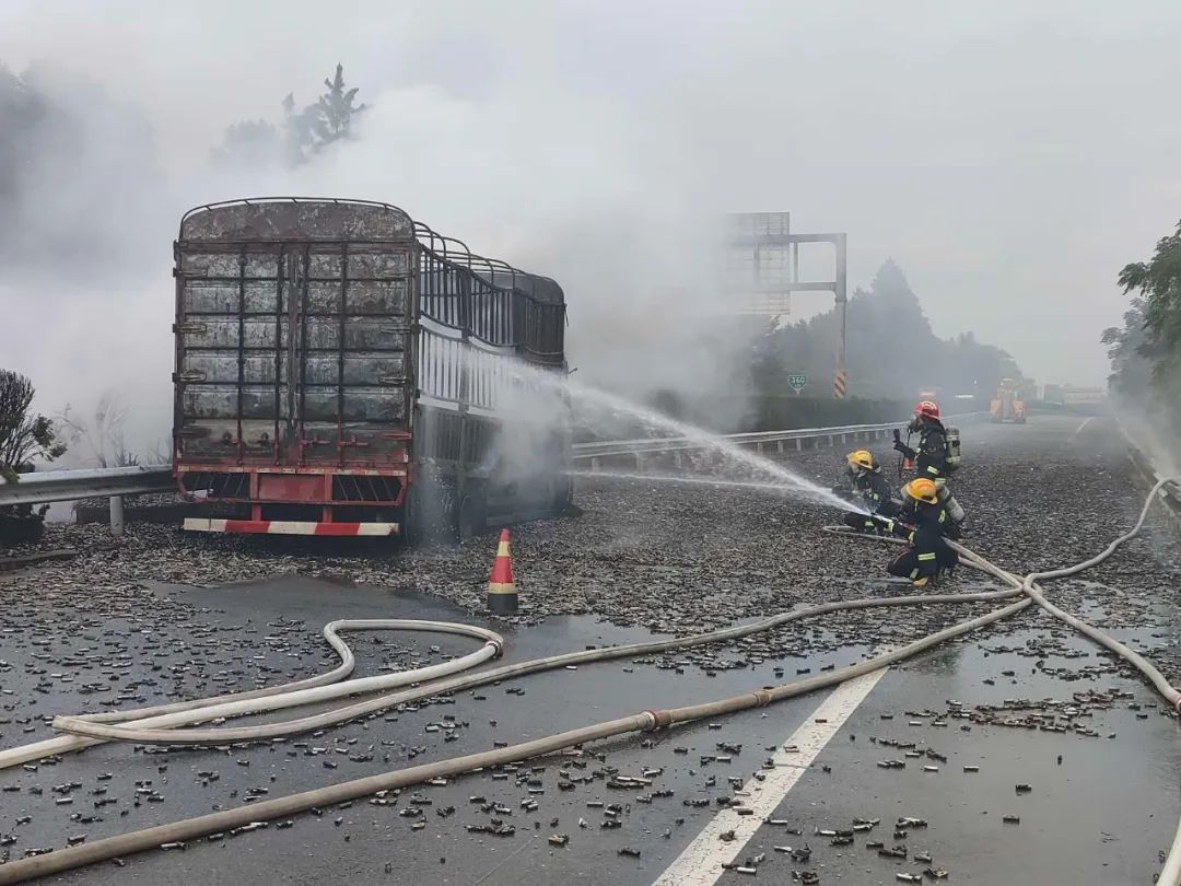 A truck loaded with lithium batteries catches fire in Jiangxi China, cargo sparks like fireworks from the container